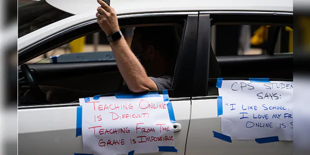 Chicago Teachers Union members and supporters join a car caravan outside Chicago Public Schools (CPS) headquarters while a Chicago Board of Education meeting takes place inside in Chicago, Ill., on July 22, 2020. (Max Herman/NurPhoto via Getty Images)