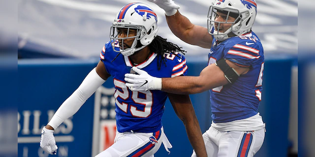 Buffalo Bills cornerback Josh Norman (29) celebrates his touchdown with outside linebacker Matt Milano (58) in the second half of an NFL football game against the Miami Dolphins, Sunday, Jan. 3, 2021, in Orchard Park, N.Y. (AP Photo/Adrian Kraus)