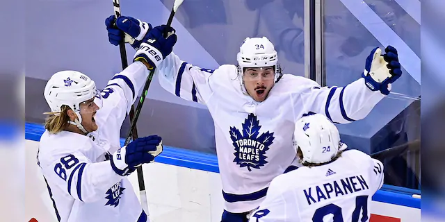 Toronto Maple Leafs' Auston Matthews (34) celebrates his winning goal against the Columbus Blue Jackets with teammates William Nylander (88) and Kasperi Kapanen (24) during overtime of an NHL hockey playoff game Friday, Aug. 7, 2020, in Toronto. (AP)