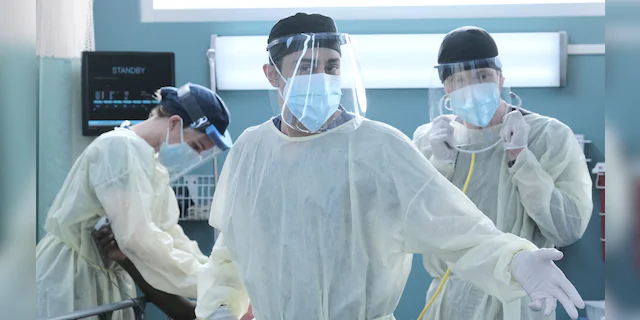 L-R: Emily VanCamp, Manish Dayal and Matt Czuchry in full PPE during the premiere episode of 'The Resident.'