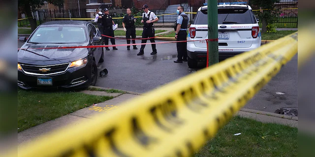 Police investigate the scene of a shooting in the Auburn Gresham neighborhood on July 21, 2020, in Chicago. (Scott Olson/Getty Images, File)