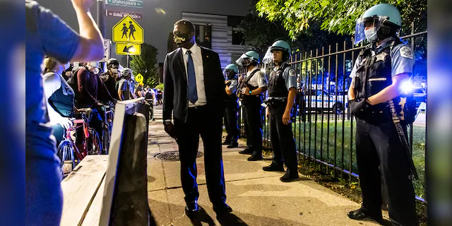 Members of the Chicago Police Department confronted protesters during a march for Breonna Taylor on September 23, 2020 in Chicago, Illinois. (Photo by Natasha Moustache/Getty Images)