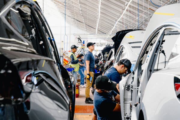 A Tesla factory in Fremont, Calif. A global shortage in semiconductors — a crucial component in cars and electronic devices — has forced several major American auto plants to close or scale back production.