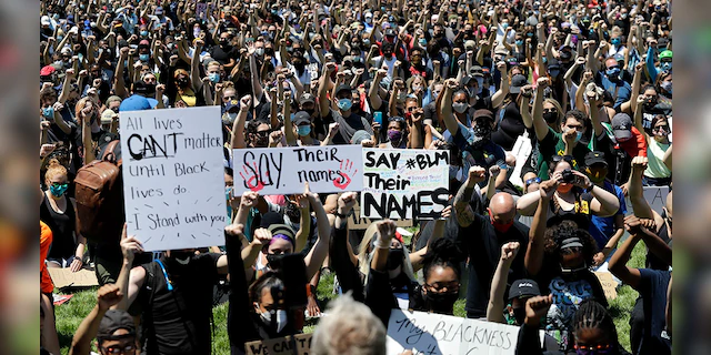 Thousands of people gather for the Chicago March for Justice in honor of George Floyd at Chicago's Union Park Saturday, June 6, 2020, in Chicago. (AP Photo/Nam Y. Huh)