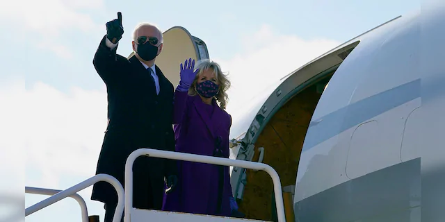 President-elect Joe Biden and his wife Jill Biden board a plane at New Castle Airport, Tuesday, Jan. 19, 2021, in New Castle, Del. (AP Photo/Evan Vucci)