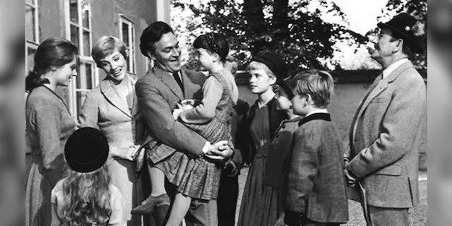 Debbie Turner (being held by Christopher Plummer) starred in 'The Sound of Music' alongside the late actor.