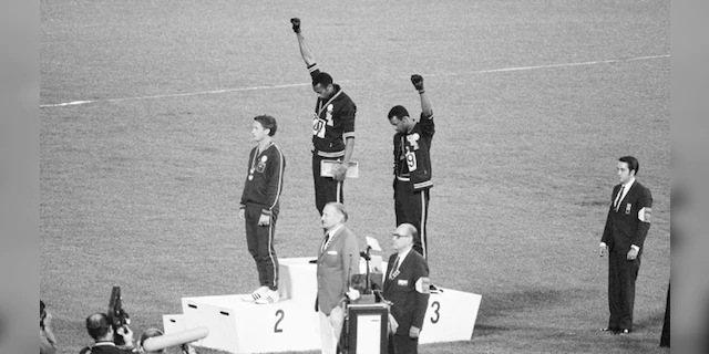 Americans Tommie Smith and John Carlos raised black-gloved fists in the Black power salute in protest during the national anthem at the 1968 Mexico Games.