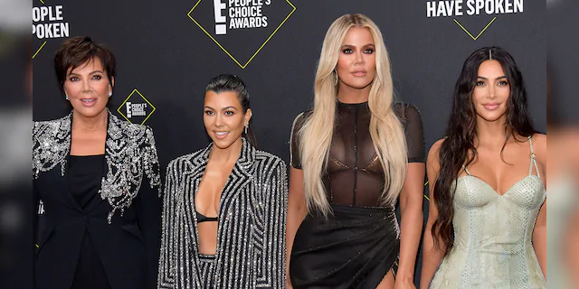 Kim Kardashian (far right) is one of Robert Kardashian Sr.'s three daughters along with Kourtney (second from left) and Khloe (second from right) Their mother is Kris Jenner (far left) and their brother is Robert Kardashian Jr. (not pictured). (Photo by Frazer Harrison/Getty Images)
