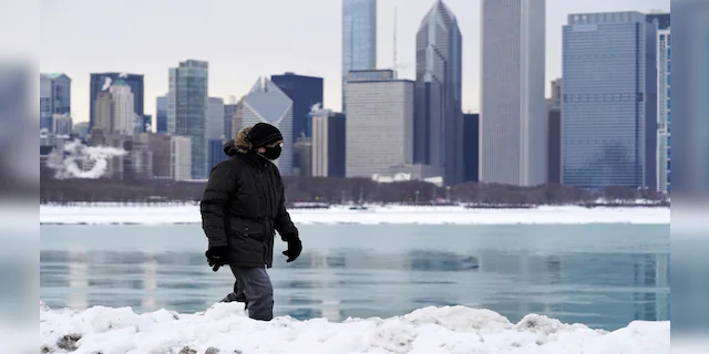 A man is bundled up against the cold in Chicago on Sunday. (AP)