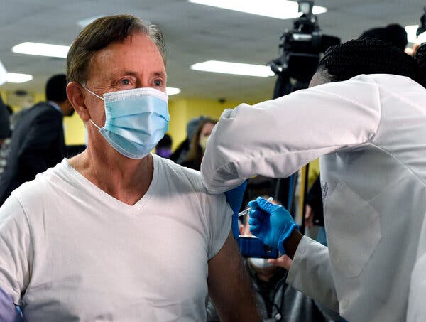 Gov. Ned Lamont of Connecticut receiving his first dose of vaccine.