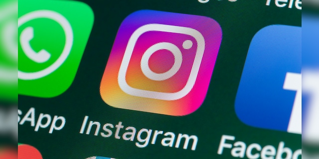 The buttons of the photo app Instagram, surrounded by WhatsApp, Facebook, Messages and other apps on the screen of an iPhone. (iStock)