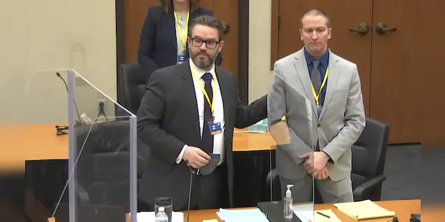 In this screen grab from video, defense attorney Eric Nelson, left, defendant and former Minneapolis police officer Derek Chauvin, right, introduce themselves to jurors as Hennepin County Judge Peter Cahill presides over jury selection in the trial of Chauvin Wednesday, March 17, 2021. (Court TV, via AP, Pool)
