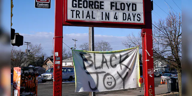 A trial countdown sign marks the days at George Floyd Square, March 4, 2021, in Minneapolis. (AP Photo/Jim Mone)