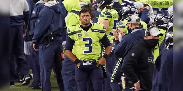 Seattle Seahawks quarterback Russell Wilson (3) looks up as he stands on the sidelines against the Minnesota Vikings late in the second half of an NFL football game, Sunday, Oct. 11, 2020, in Seattle. (AP Photo/Ted S. Warren)