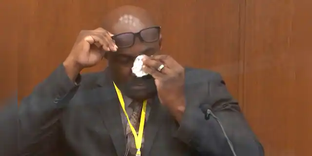 In this image from video, Philonise Floyd, brother of George Floyd, becomes emotional as he testifies as Hennepin County Judge Peter Cahill presides over court Monday, April 12, 2021, in the trial of former Minneapolis police Officer Derek Chauvin, in the May 25, 2020, death of George Floyd at the Hennepin County Courthouse in Minneapolis, Minn. (Court TV via AP, Pool)