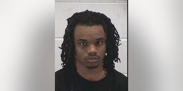 Edward James McGee and a juvenile have been charged in connection with a violent carjacking that left a mother of two paralyzed. (Aurora Police Department via AP)