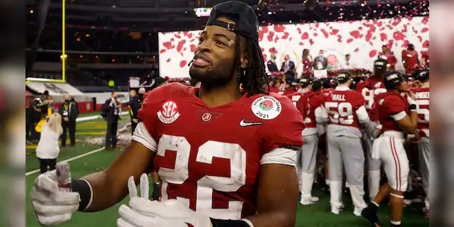Alabama running back Najee Harris celebrates after their win against Notre Dame in the Rose Bowl NCAA college football game in Arlington, Texas, Friday, Jan. 1, 2021. (AP Photo/Michael Ainsworth)