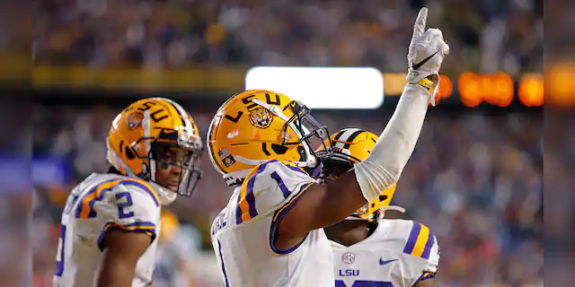 LSU wide receiver Ja'Marr Chase (1) celebrates his touchdown reception in the second half of an NCAA college football game against Florida in Baton Rouge, La., Saturday, Oct. 12, 2019. LSU won 42-28. (AP Photo/Gerald Herbert)