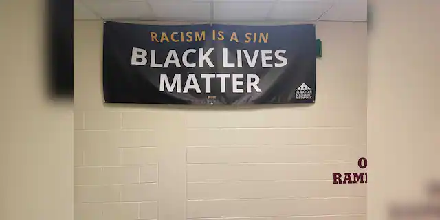 A Black Lives Matter banner that hangs in a hallway at Loyola Academy.