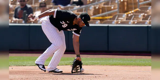 Chicago White Sox first baseman Jose Abreu fields a ground ball hit by San Francisco Giants' Jason Vosler during the second inning of a spring training baseball game Monday, March 22, 2021, in Phoenix. (AP Photo/Ross D. Franklin)