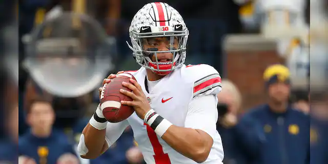 Ohio State quarterback Justin Fields throws against Michigan in the first half of an NCAA college football game in Ann Arbor, Mich., Saturday, Nov. 30, 2019. (AP Photo/Paul Sancya)