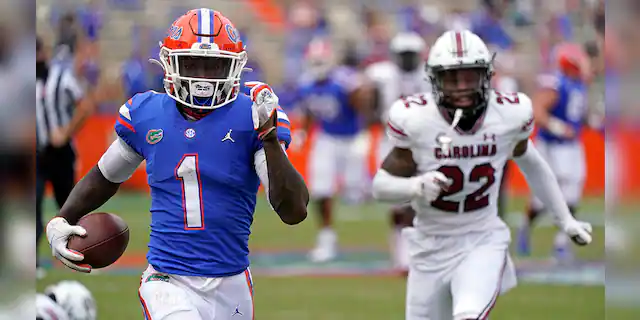 Florida wide receiver Kadarius Toney (1) gets past South Carolina defensive back John Dixon (22) for a 57-yard touchdown run during the second half of an NCAA college football game, Saturday, Oct. 3, 2020, in Gainesville, Fla. (AP Photo/John Raoux, Pool)