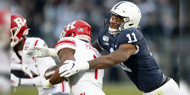 FILE - In this Nov. 30, 2019, file photo, Penn State linebacker Micah Parsons (11) tackles Rutgers tight end Johnathan Lewis (11) in the first quarter of an NCAA college football game, in State College, Pa. (AP Photo/Barry Reeger, File)