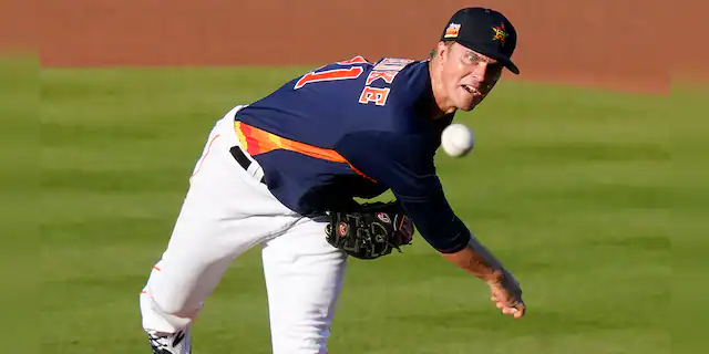 Houston Astros starting pitcher Zack Greinke throws during the first inning of the team's spring training baseball game against the Miami Marlins, Friday, March 26, 2021, in West Palm Beach, Fla. (AP Photo/Lynne Sladky)