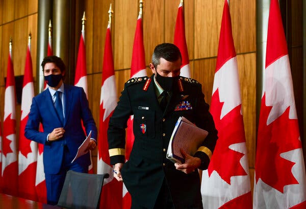 Maj. Gen. Dany Fortin, right, with Prime Minister Justin Trudeau of Canada in Ottawa in December.