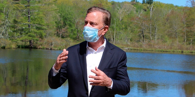 Connecticut Gov. Ned Lamont speaks to reporters at Gay City State Park in Hebron, Conn. on Thursday May 21, 2020. The governor held his daily COVID-19 briefing for the media at the park in advance of the Memorial Day weekend. (AP Photo/Pat Eaton-Robb)