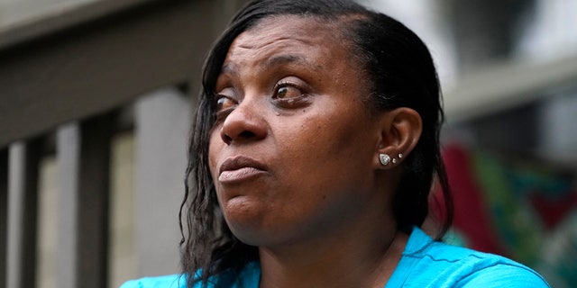Tammie Townsend tears up as she speaks about her eldest son, Willie Jones Jr., and his attentiveness and love for his son at the family home in Forest, Miss., April 27, 2021. Jones, was 21 when he was found hanging from a tree in his girlfriend's Scott County yard three years ago. A Hinds County judge recently awarded the family $11 million in a civil suit related to his death. (AP Photo/Rogelio V. Solis)