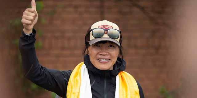 Tsang Yin-hung, 45, from Hong Kong, scaled Mount Everest from the base camp in 25 hours and 50 minutes and became the fastest female climber. (AP Photo/Bikram Rai)