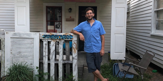Journalist Danny Fenster, 37, is pictured in June 2018 outside his house in Lafayette, LA. 