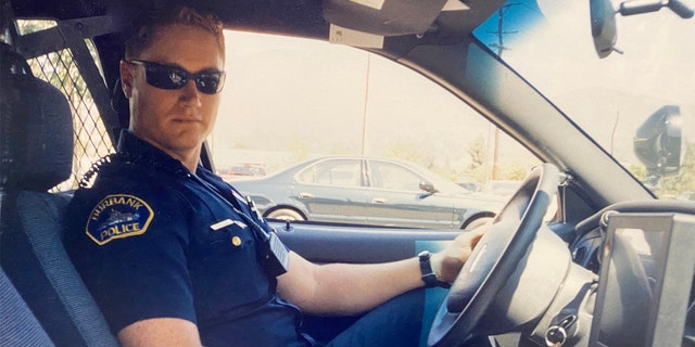 Officer Matthew Pavelka in his police cruiser.