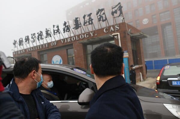 Members of the World Health Organization team investigated the origins of the coronavirus in Wuhan, China last February. A group of scientists on Thursday called for a new investigation.