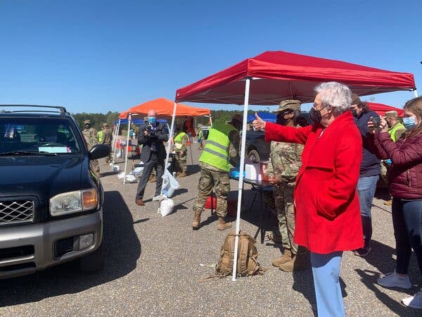 Alabama Gov. Kay Ivey gives a thumbs up to people in line to get Covid-19 vaccinations at an Alabama National Guard clinic in Camden, Ala., in early April.