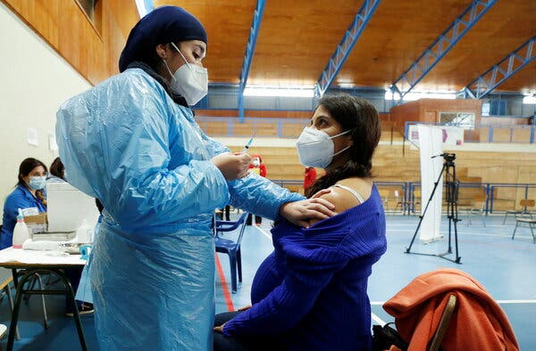 A pregnant woman receiving a dose of the Pfizer vaccine in Villa Alemana, Chile, last month.