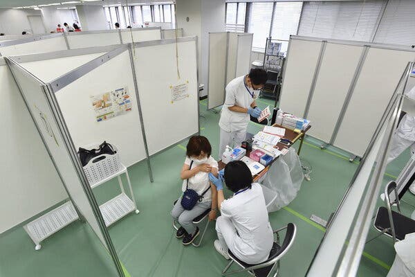 Administering a coronavirus vaccine at a center in Osaka, Japan, on Monday.