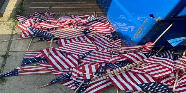 Some of the flags were left near a dumpster. (Courtesy VFW Post &amp; Auxiliary #1138)