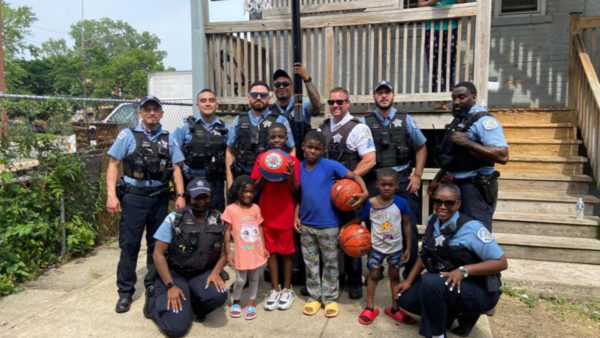 Chicago police officers surprise children with new basketball hoop after seeing them play with milk crate