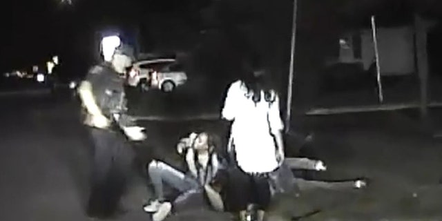 The dashcam video appeared to show two female suspects on top of the officer pinning him to the ground