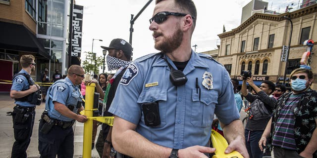 Police investigate a shooting as protesters gather on Thursday, June 3, 2021, in Minneapolis.  (Richard.Tsong-Taatari/Star Tribune via AP)