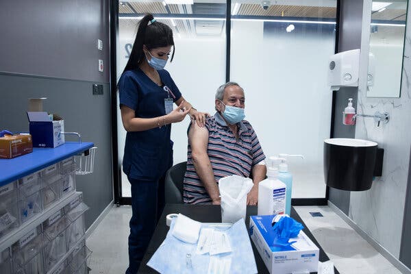 A man receiving a third dose of a Covid-19 vaccine last week at a medical center near Tel Aviv.