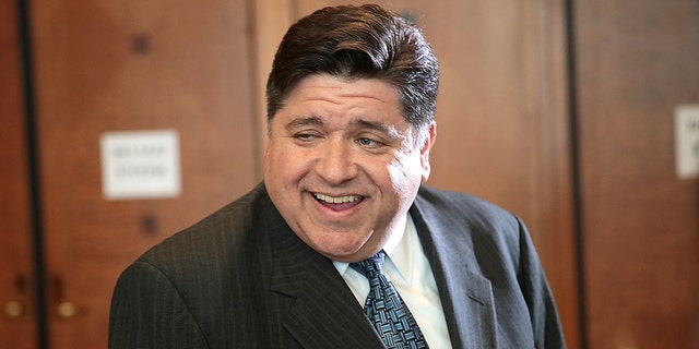  Illinois Gov. J.B. Pritzker attends the Idas Legacy Fundraiser Luncheon on April 12, 2018, in Chicago. Pritzker urged vaccinated people to bring masks with them when they leave the house last week. (Scott Olson/Getty Images)