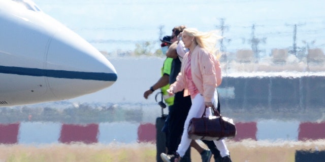 Erika Jayne was spotted boarding a private jet despite her mounting legal and financial troubles.