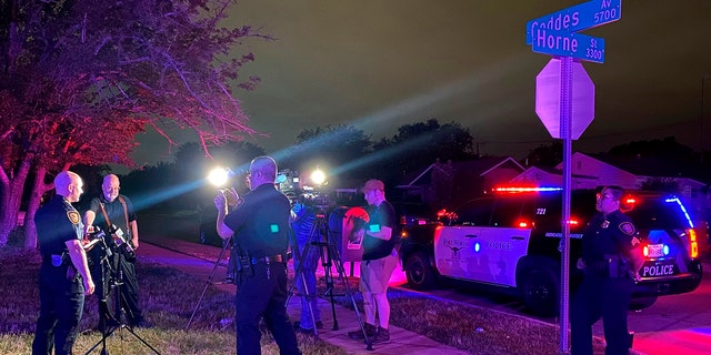 Fort Worth Police Chief Neil Noakes holds a news briefing at the site of a shooting early Sunday, July 4, in Fort Worth, Texas. Multiple people were wounded early Sunday in a shooting near a Fort Worth car wash in which it appears multiple guns were used, police said. (Fort Worth Police Dept. via AP)