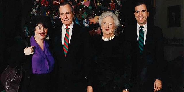 Janet Cawley and her brother Phil, far right, pictured with President George H.W. Bush and first lady Barbara Bush at the White House Christmas party.