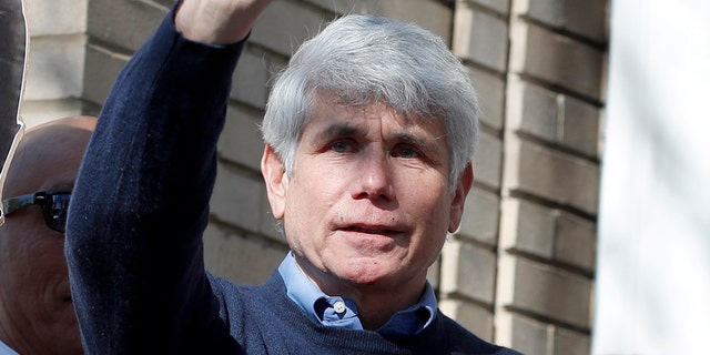 Former Illinois Gov. Rod Blagojevich and his wife Patti wave to supporters after a news conference outside his home Wednesday, Feb. 19, 2020, in Chicago. On Tuesday, President Donald Trump commuted his 14-year prison sentence for political corruption. (AP Photo/Charles Rex Arbogast)