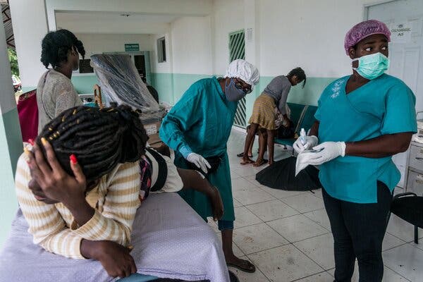 An earthquake victim received treatment on Wednesday at the Ofatma Hospital in Les Cayes, Haiti. With disaster victims crowding the island’s hospitals, fewer resources are available for Covid-19 patients, W.H.O. officials warned. 