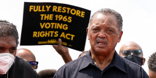 FILE - In this Monday, Aug. 2, 2021 file photo, Rev. Jesse Jackson speaks to the crowd during a demonstration supporting the voting rights, on Capitol Hill, in Washington. The Rev. Jesse Jackson and his wife, Jacqueline, have been hospitalized after testing positive for COVID-19 according to a statement Saturday, Aug. 21, 2021. He is vaccinated against the virus and publicly received his first dose in January. According to a statement released Saturday evening, the Jacksons are being treated at Northwestern Memorial Hospital in Chicago. He is 79 years old. Jacqueline Jackson is 77. (AP Photo/Jose Luis Magana, File)